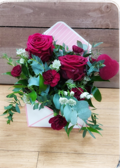 Message of Love - Envelope shaped design with 3 Roses and seasonal foliages
