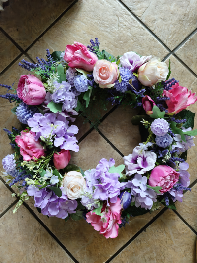 Artificial Spring Wreath - Constructed on a 16" willow wreath ring with a mixture of artificial blooms in vibrant Spring colours. OPTIONAL - Can be gift wrapped if required.